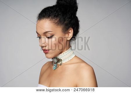 Beauty Closeup Portrait Of Beautiful Mixed Race Woman Wearing Chocker Posing, Isolated On Gray Backg