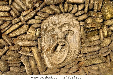 Ancient Brown Stone Face Yawns For Background