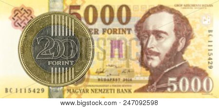 200 Hungarian Forint Coin Against 5000 Hungarian Forint Bank Note Obverse