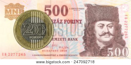 200 Hungarian Forint Coin Against 500 Hungarian Forint Bank Note Obverse
