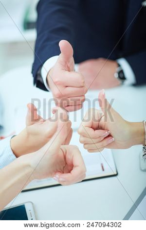 Hands Of Business Team With Tumbs Up.