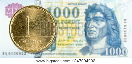 1 Forint Coin Against 1000 Hungarian Forint Bank Note Obverse