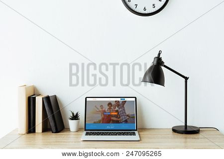Laptop With Couchsurfing Website On Screen On Work Desk At Office