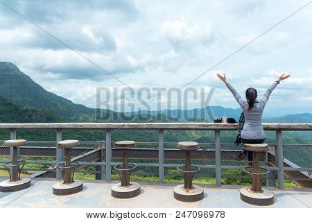 Smiling Asian Woman Drinking Coffee And Tea And Take A Photo And Relax In Sun Sitting Outdoor In Sun