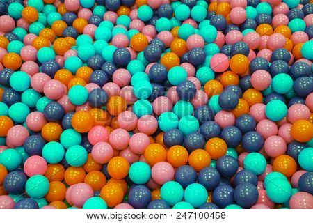 Colorful Child Balls. Multi-colored Plastic Balls. A Children's Playroom. Background Texture Of Mult
