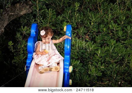 Kid Portrait On A Garden