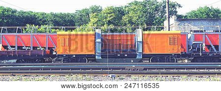 Railway, The Working Staff Is On The Rails, Yellow And Red Cars In Order