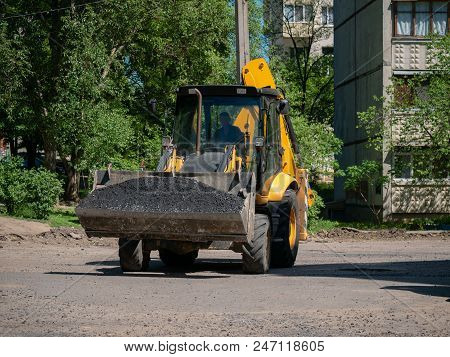 Buldozer Making And Constructing A New Asphalt Road Near The Civil Building. Concepts Of Improvement
