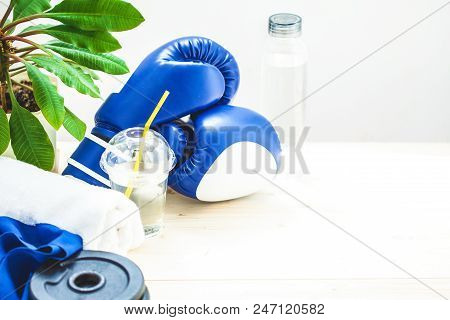 Set For Sports, Towel, Boxing Gloves, Dumbbell And A Bottle Of Water On A Light Background. The Conc
