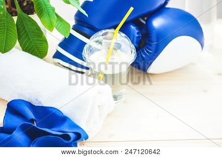 Set For Sports, A Yoga Mat, A Towel, Boxing Gloves And A Bottle Of Water On A Light Background. The 
