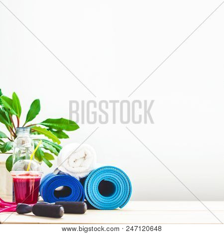 Set For Sports, A Yoga Mat, A Towel, Smoothies Jumping Rope, A Bottle Of Water. The Concept Of A Hea