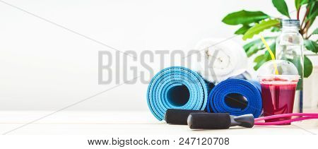 Set For Sports, A Yoga Mat, A Towel, Smoothies Jumping Rope, A Bottle Of Water. The Concept Of A Hea