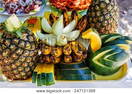 Fresh Tropical Fruits On The Beach. Fresh Tropical Fruits On The Table. The Concept Of Relaxation. H