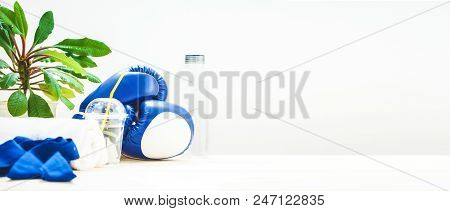 Set For Sports, A Yoga Mat, A Towel, Boxing Gloves And A Bottle Of Water On A Light Background. The 