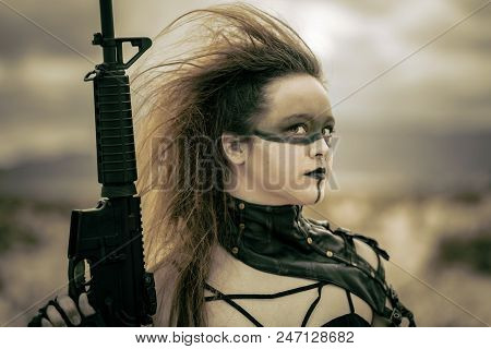 In A Post-apocalyptic Desert Wasteland, Two Queens Lead Their Militias Against Each Other. Armed To 