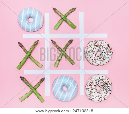 Tik Tak Toe Game With Donuts And Asparagus. Health Nutrition Concept Image