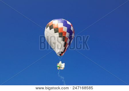 Hot Air Balloon Isolated On Beautiful Sky