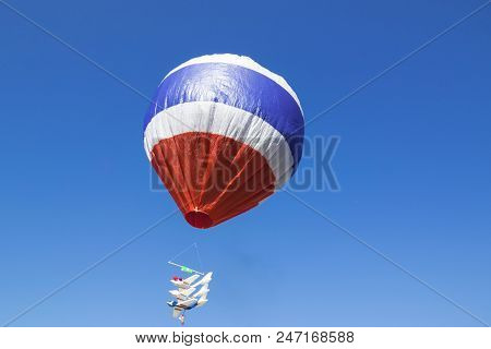 Hot Air Balloon Isolated On Beautiful Sky