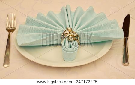 Napking With Ring Decorations On Wedding Table