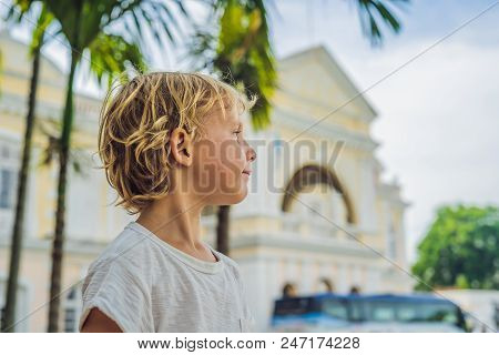 Boy On Background Of Old Town Hall In George Town In Penang, Malaysia. The Foundation Stone Was Laid