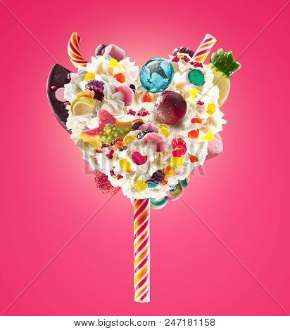 Sweet Lolipop In Heart Form Of Whipped Cream With Sweets, Jellies, Heart Front View. Crazy Freakshak