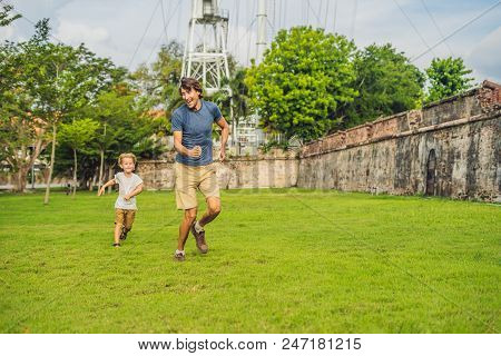 Dad And Son On Background Of Fort Cornwallis In Georgetown, Penang, Is A Star Fort Built By The Brit