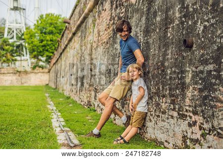 Dad And Son On Background Of Fort Cornwallis In Georgetown, Penang, Is A Star Fort Built By The Brit