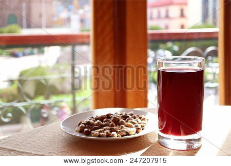 Chicha Morada, Popular Peruvian Traditional Drinks Served With A Plate Of Andean Toasted Corn