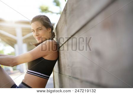 Fitness girl relaxing after exerciing
