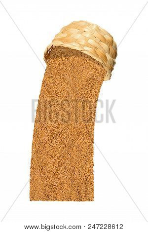 Yellow Indian Mustard Seeds (brassica Alba Boiss) Poured Out Of Wicker Basket Isolated On White Back