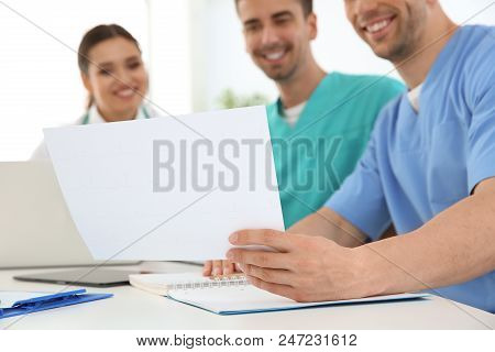 Group Of Doctors Attending Meeting In Clinic. Cardiology Conference