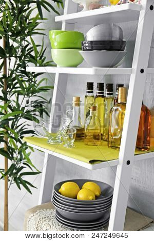 Kitchen stuff on white shelve stand