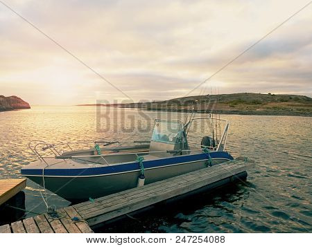 Wooden Pier With Fishing Boats In Oyster Farm In Sea Harbor Bay On Beautiful Mountain Landscape
