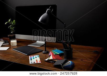 Close Up View Of Graphic Designer Workplace With Colorful Pallet, Graphic Tablet, Computer Screen An