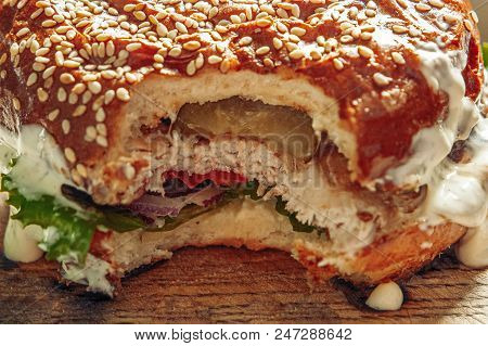 Macro Of Burger With Pice Bitten Off