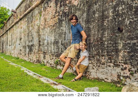 Dad And Son On Background Of Fort Cornwallis In Georgetown, Penang, Is A Star Fort Built By The Brit