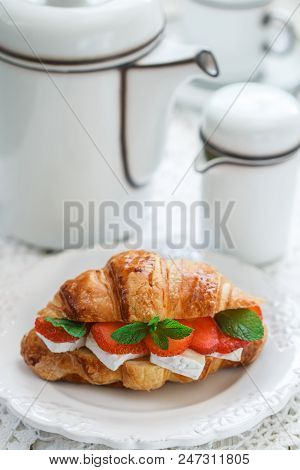 Croissant With Strawberries, Brie Cheese Or Camambert And Mint. Delicious Gourmet Breakfast. Selecti