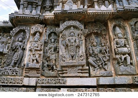 Ornate Bas Relieif And Sculptures Of Hindu Deities, Kedareshwara Temple, Halebid, Karnataka, India.