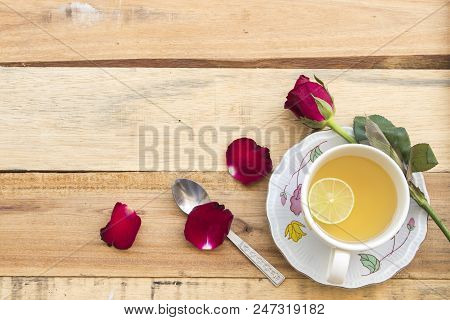 Herbal Health Care Hot Mix Honey Lemon And Cough Sore Throat Pastille With Red Rose Flower On Backgr
