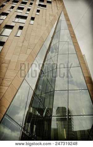 Modern Architecture In The City.the Building At A Low Angle View.reflections In The Glass.retro Styl