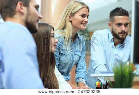 Group Of Young Modern People In Smart Casual Wear Having A Brainstorm Meeting While Standing In The 