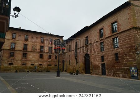 Spectacular Typical Plaza With Its Reddish-hued Buildings In Najera. Architecture, Travel, History. 