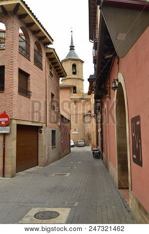 View Of The Bell Tower Of La Cruz Church In The Plaza De Navarra De Najera From One Of Its Narrow St