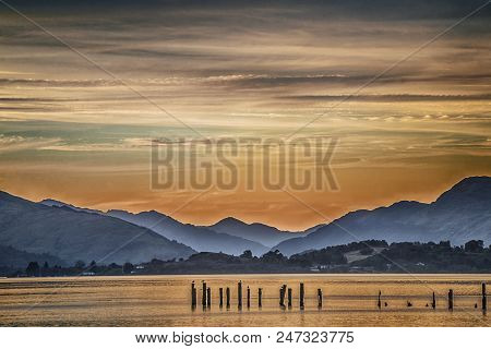 Beautiful Sunset Andscape With Lake Loch Lomond And Hills In Scotland
