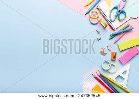 Colorful Stationary School Supplies On Blue Trending Background, Space Or Text Flat Lay