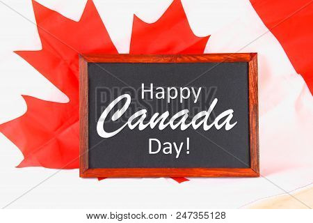 Chalkboard With The Word Happy Canada Day On The National Flag. Feast Of 1 July