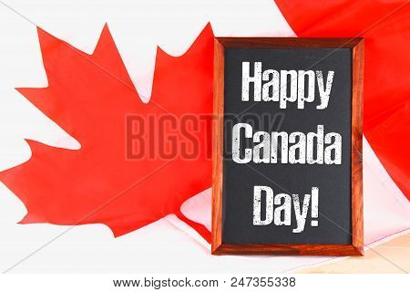 Chalkboard With The Word Happy Canada Day On The National Flag. Feast Of 1 July
