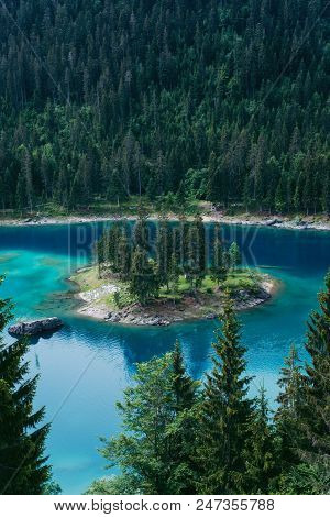 Caumasee Lake With A Small Island Located In The Middle Of The Crystal Clean Lake, Near Flims, Switz