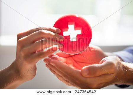 Woman Giving First Aid Medical Sign To Man