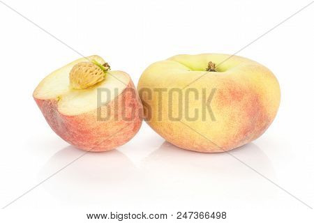 One Fresh Ripe Saturn Peach With A Half Isolated On White Background